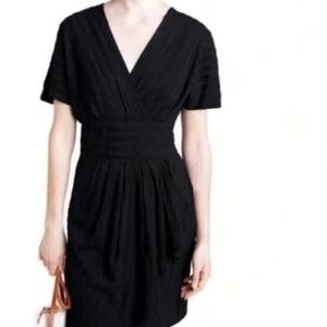 Anthropologie Aryessa black dolman short sleeve wrap textured dress.